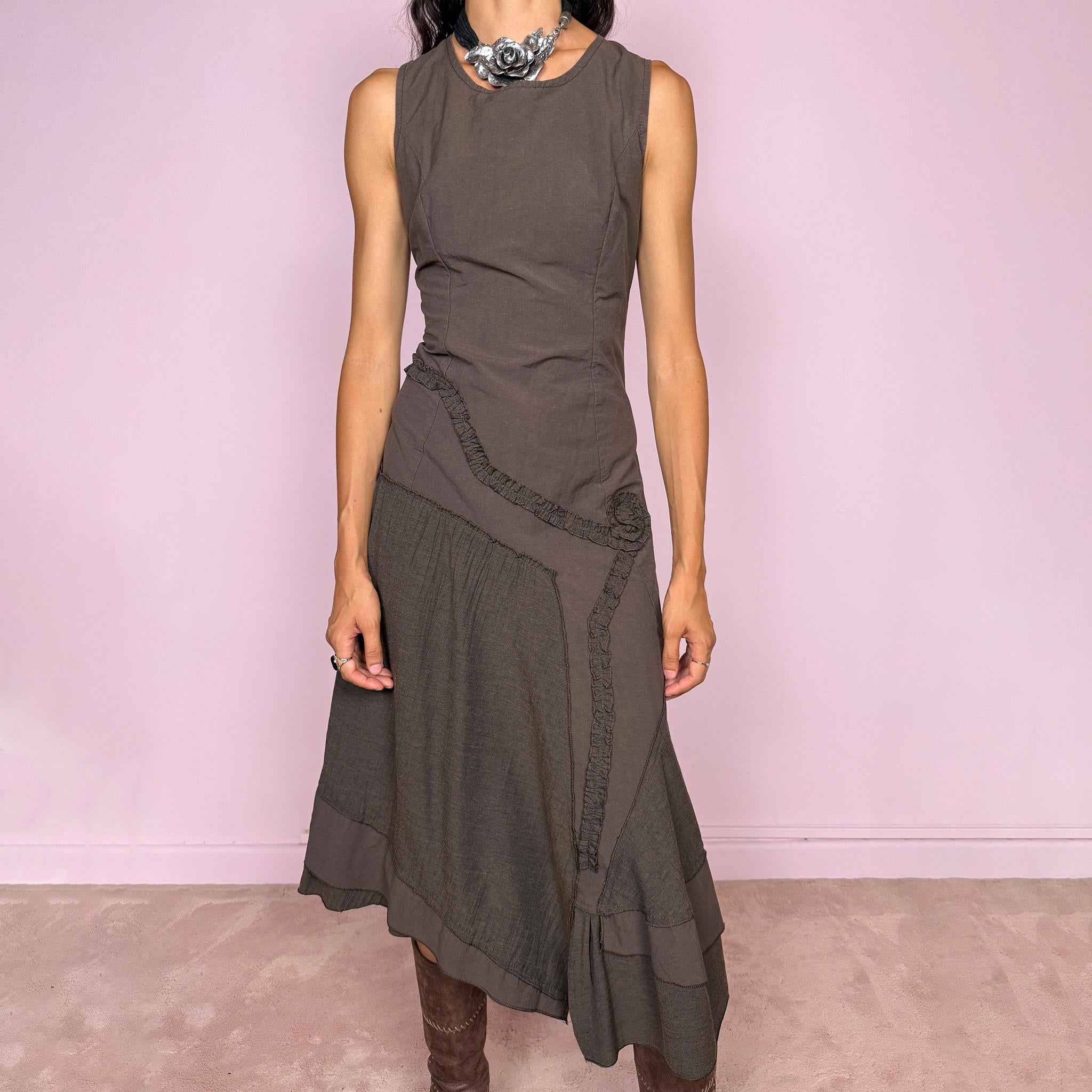 Vintage 2000s brown asymmetric midi dress featuring a sleeveless silhouette with sculptural panel construction, mixed tonal textures, and ruffled trim creating an organic, deconstructed effect across the body. Finished with an irregular asymmetric hem and back zip closure. No stretch. Made in France by a French brand from 61% viscose and 39% polyester.