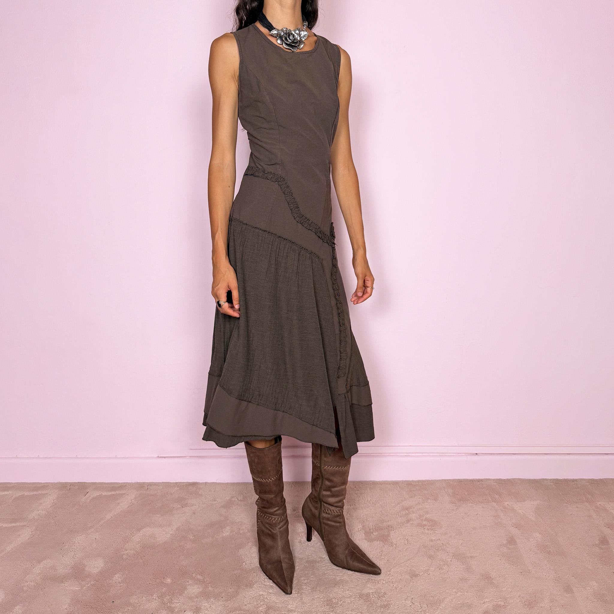 Vintage 2000s brown asymmetric midi dress featuring a sleeveless silhouette with sculptural panel construction, mixed tonal textures, and ruffled trim creating an organic, deconstructed effect across the body. Finished with an irregular asymmetric hem and back zip closure. No stretch. Made in France by a French brand from 61% viscose and 39% polyester.