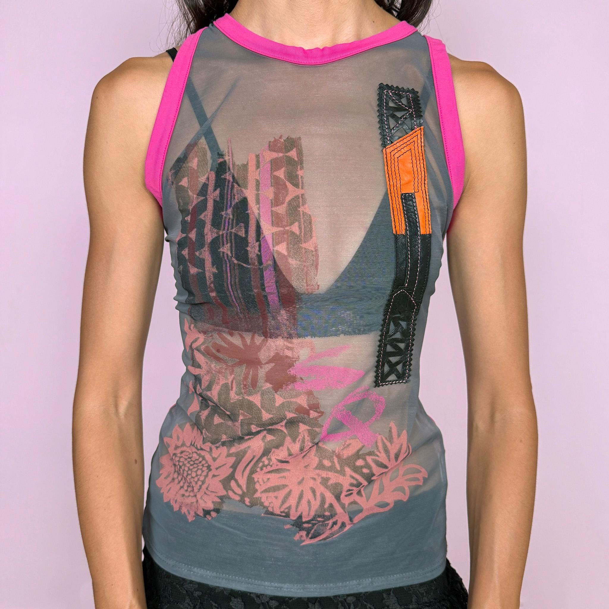 Vintage 2000s Save the Queen sleeveless sheer mesh top featuring an eclectic mixed graphic print in gray with vivid fuchsia contrast trim, intricate embroidery, and genuine leather appliqué inserts across the front, plus textured geometric detailing throughout the back. Perfect for bold, deconstructed summer outfits. Made in Italy from 100% polyamide with leather inserts. Excellent vintage condition.