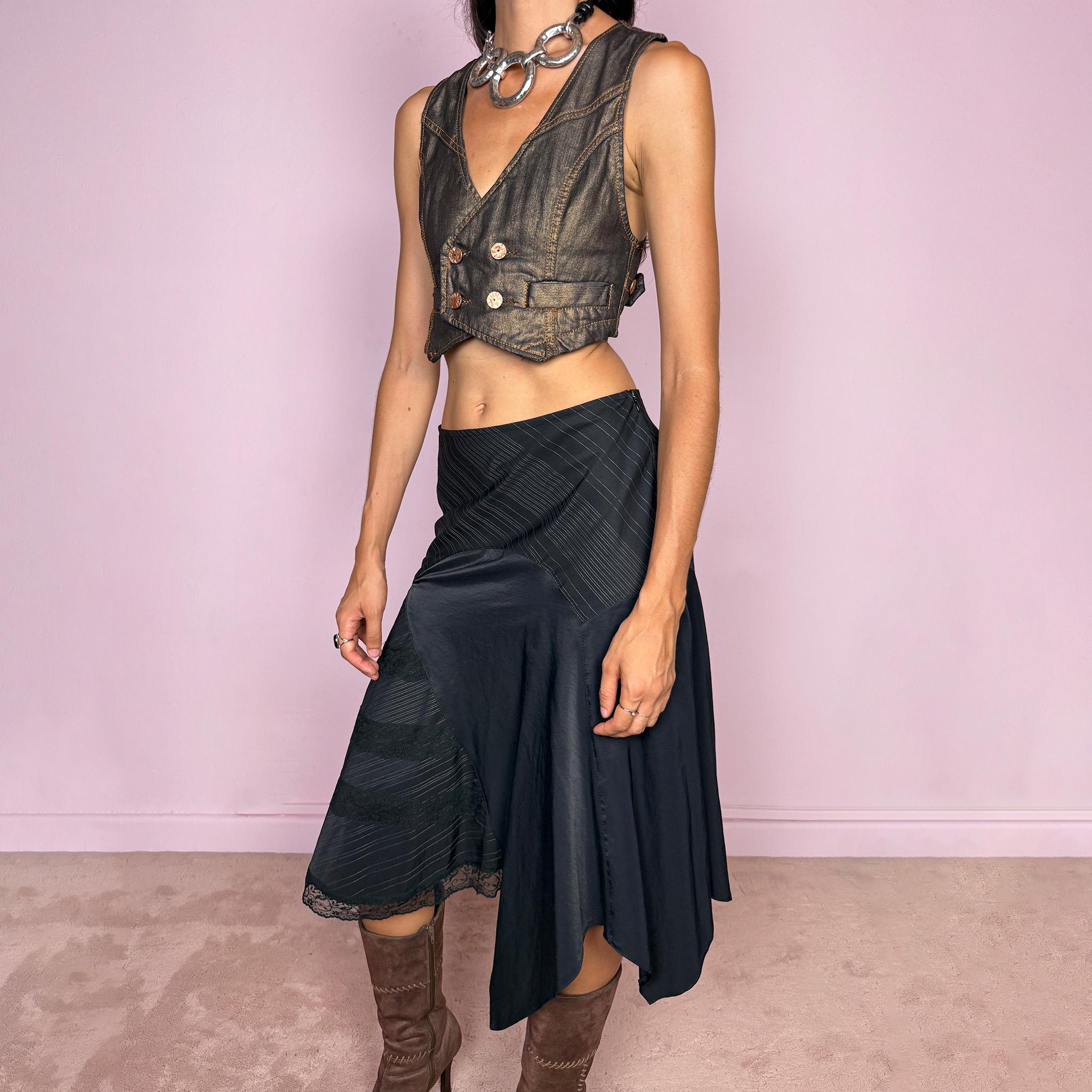 Vintage 2000s black asymmetric midi skirt featuring a deconstructed patchwork construction that combines fine pinstripe panels with contrasting fabric sections and subtle lace-trim detailing. Designed with a dramatic irregular handkerchief-style hem and a dark avant-garde Y2K silhouette. Features a side zip closure and no stretch. Can be worn high-waisted for size M or mid- to lower-rise for sizes S–XS.