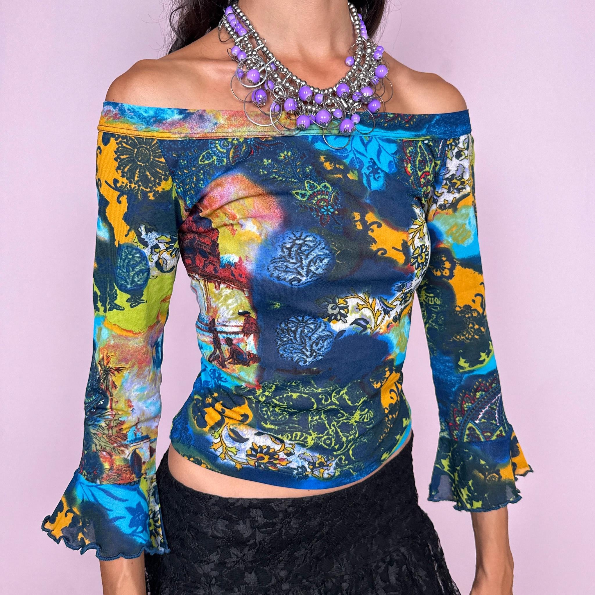 Vintage 2000s off-shoulder mesh top featuring a fitted, semi-sheer silhouette with a wide bateau neckline and flared three-quarter sleeves. Finished in a vivid mixed graphic print combining deep blue, turquoise, lime, yellow, and ornamental motifs for a maximalist bohemian Y2K look. Made in Italy by an Italian brand from 66% polyester and 34% polyamide. Excellent vintage condition.