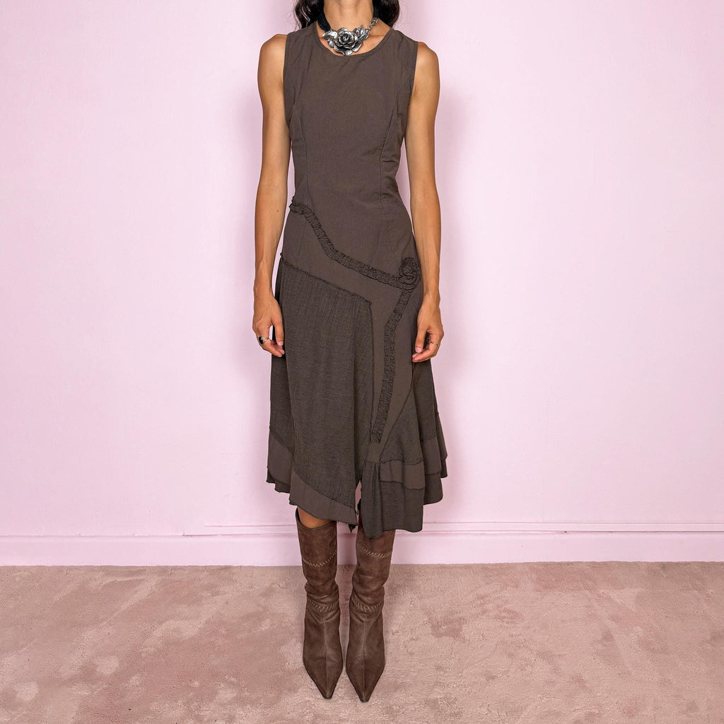 Vintage 2000s brown asymmetric midi dress featuring a sleeveless silhouette with sculptural panel construction, mixed tonal textures, and ruffled trim creating an organic, deconstructed effect across the body. Finished with an irregular asymmetric hem and back zip closure. No stretch. Made in France by a French brand from 61% viscose and 39% polyester.