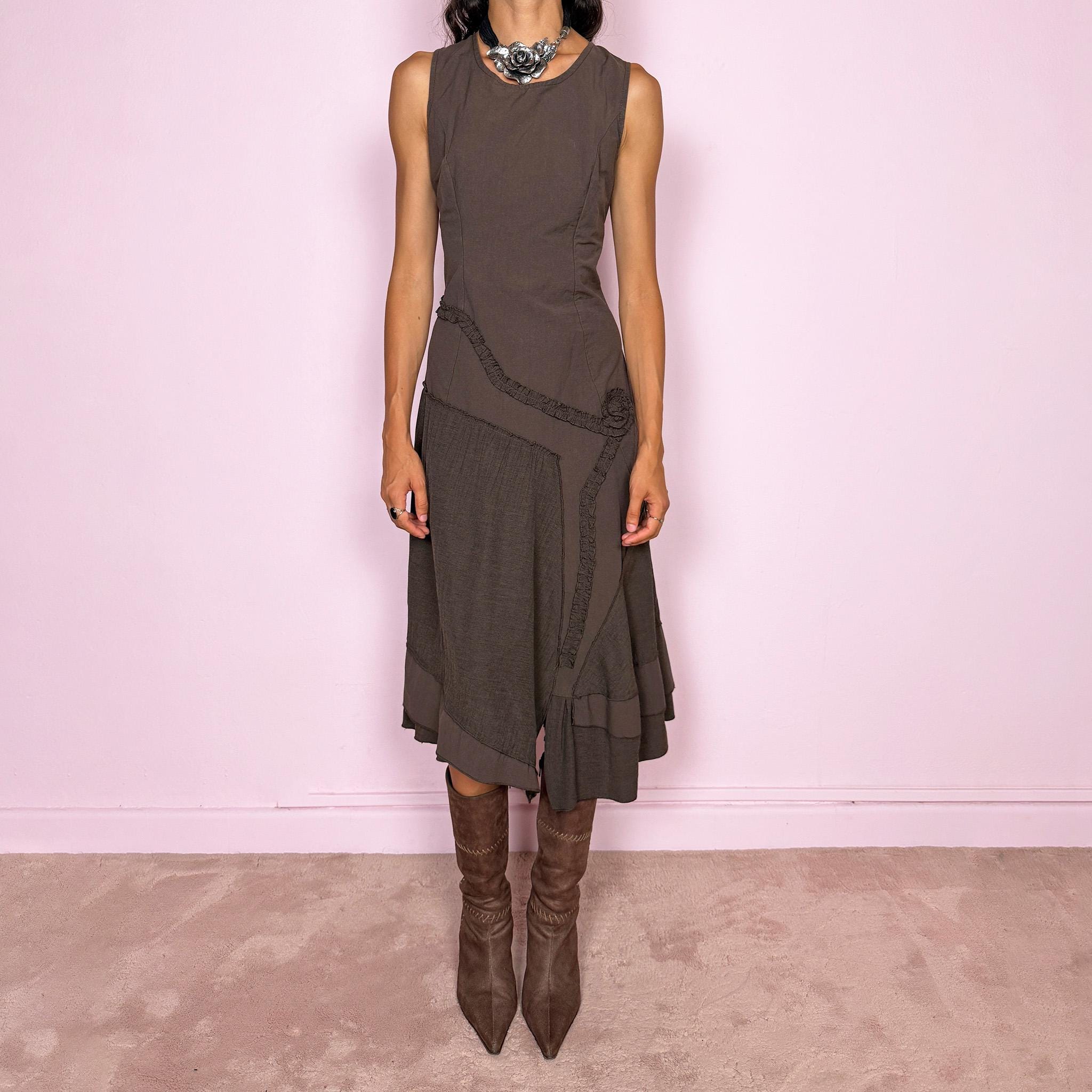 Vintage 2000s brown asymmetric midi dress featuring a sleeveless silhouette with sculptural panel construction, mixed tonal textures, and ruffled trim creating an organic, deconstructed effect across the body. Finished with an irregular asymmetric hem and back zip closure. No stretch. Made in France by a French brand from 61% viscose and 39% polyester.