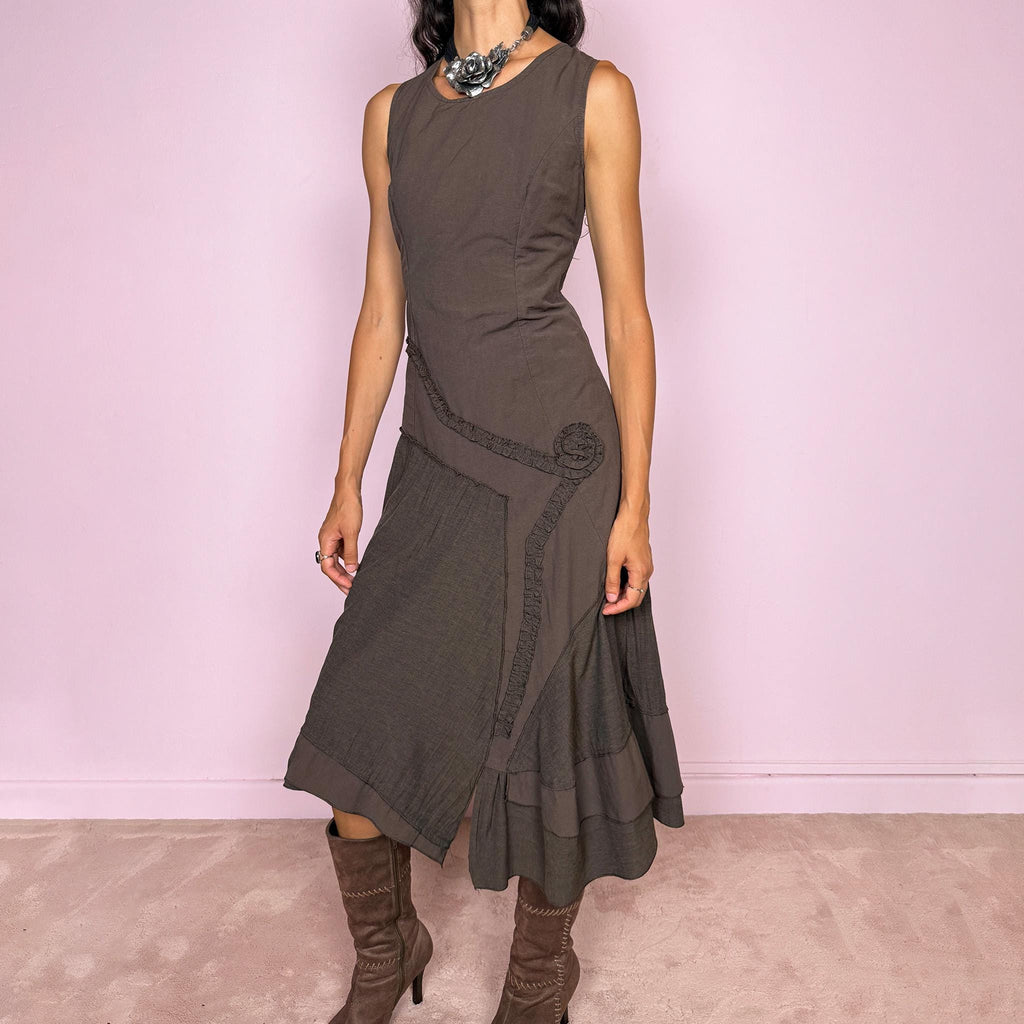 Vintage 2000s brown asymmetric midi dress featuring a sleeveless silhouette with sculptural panel construction, mixed tonal textures, and ruffled trim creating an organic, deconstructed effect across the body. Finished with an irregular asymmetric hem and back zip closure. No stretch. Made in France by a French brand from 61% viscose and 39% polyester.