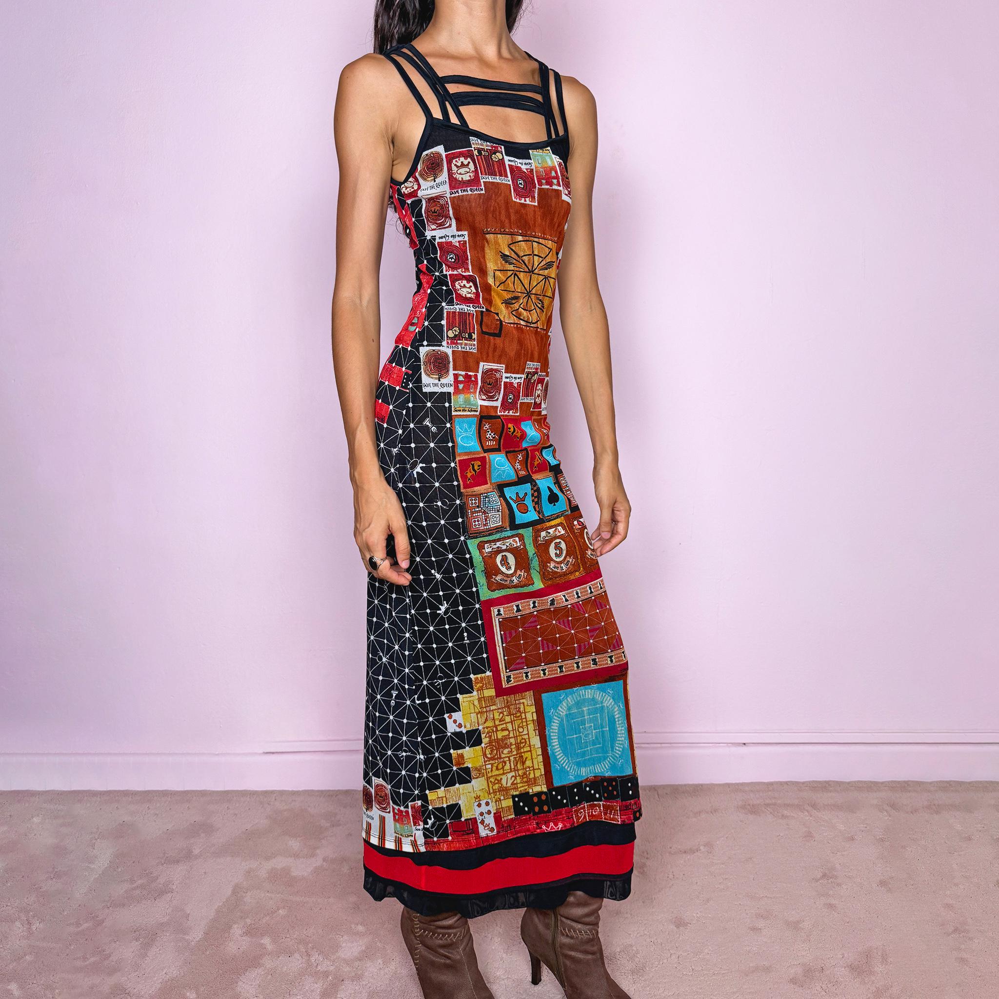 Vintage 2000s Save the Queen maxi dress, made in Italy from stretchy 100% polyamide mesh with a black mesh lining. Featuring an intricate multicolored graphic print with abstract symbols, game-inspired motifs, and richly layered artwork throughout, framed by strappy black mesh detailing across the neckline and shoulders. The long, fitted silhouette and highly detailed print give it a distinctive maximalist, art-to-wear feel characteristic of Y2K Italian fashion.