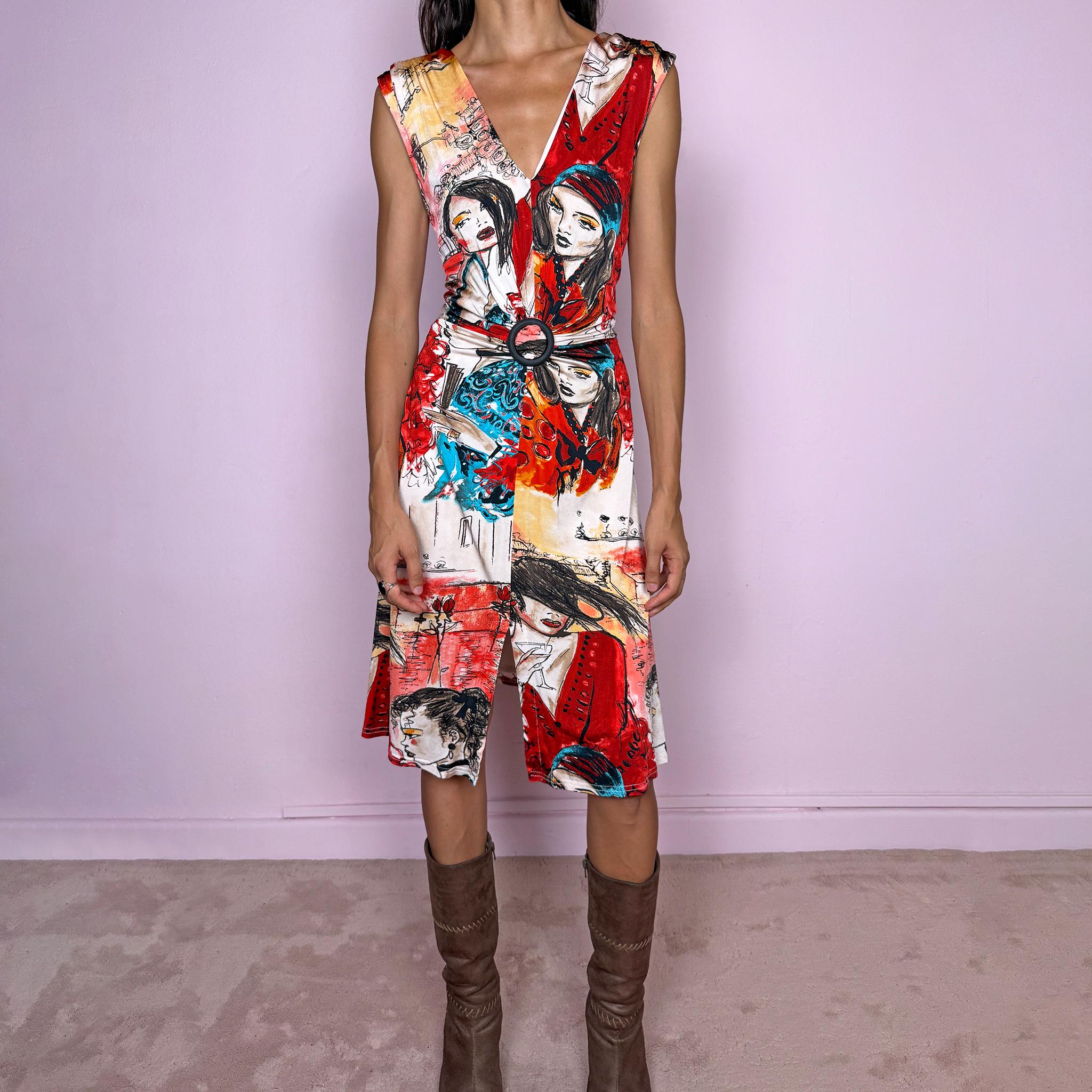 Vintage 2000s graphic midi dress by Canadian designer Joseph Ribkoff, made in Canada from a stretchy fabric with a fluid, body-skimming fit. Featuring a bold illustrated art print in red, blue, black, and cream, with stylized female figures and sketch-like graphics throughout. Designed with a deep V-neckline, sleeveless cut, front slit, and a circular buckle detail at the waist that creates draping through the front. A striking maximalist art-to-wear piece. Excellent vintage condition.