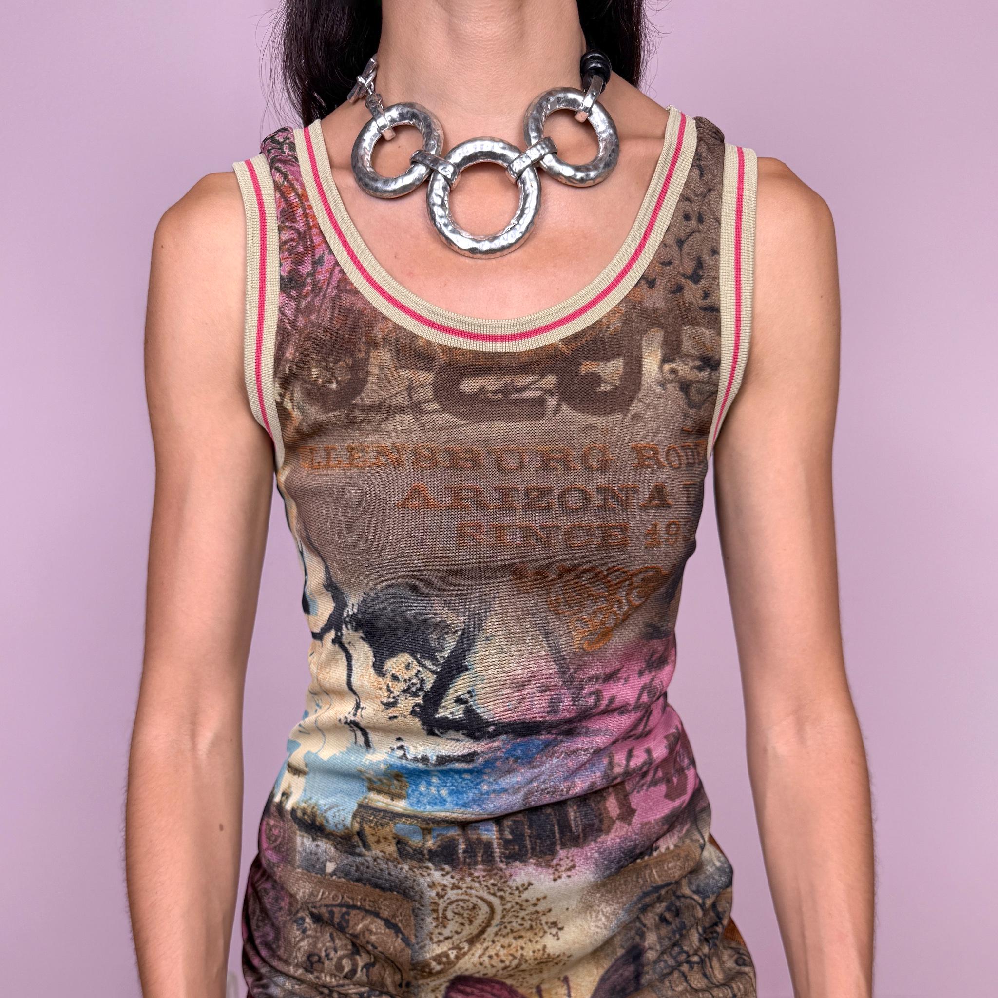 Vintage 2000s fitted sleeveless midi dress in stretchy mesh with a dark mesh lining for a softly sheer layered effect. Featuring a richly layered graphic print in brown, pink, blue, and beige tones, with butterfly imagery, faded architectural motifs, postcard-style typography, and abstract distressed details throughout. Finished with contrast trim at the neckline and armholes, and cut in a long, body-skimming silhouette for a distinctly Y2K art-to-wear, maximalist feel.