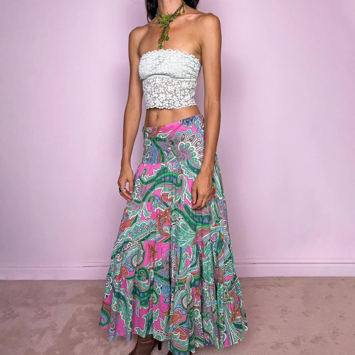 Vintage 2000s bohemian paisley maxi skirt, crafted from 100% cotton with a 100% cotton lining. Features a vibrant all-over paisley print in pink, green, blue, and orange tones, a softly flared tiered silhouette, and an elasticated waist. Can be worn mid- to low-rise for size S. By American brand Lauren Ralph Lauren. Excellent vintage condition.