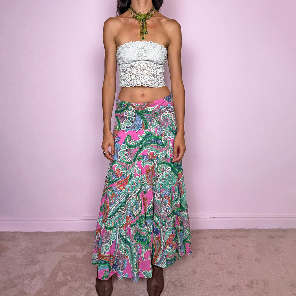 Vintage 2000s bohemian paisley maxi skirt, crafted from 100% cotton with a 100% cotton lining. Features a vibrant all-over paisley print in pink, green, blue, and orange tones, a softly flared tiered silhouette, and an elasticated waist. Can be worn mid- to low-rise for size S. By American brand Lauren Ralph Lauren. Excellent vintage condition.