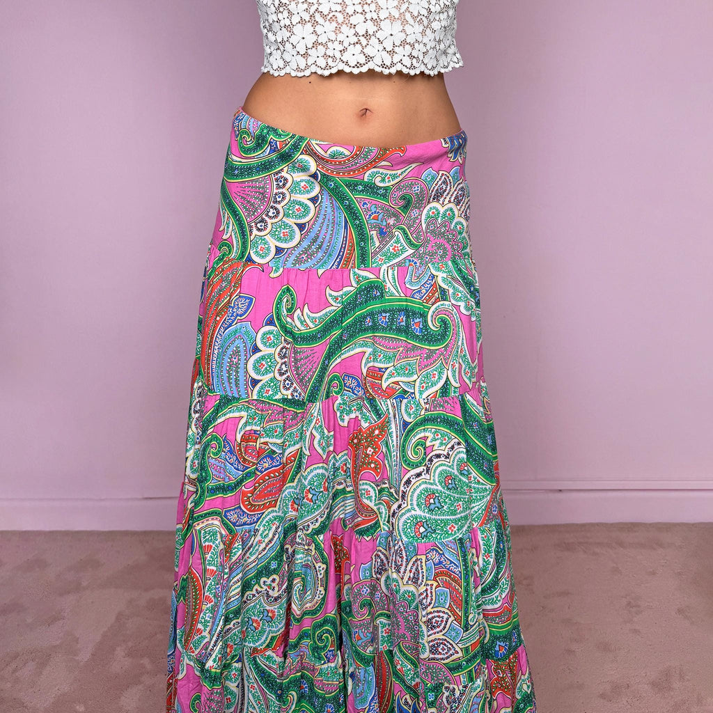 Vintage 2000s bohemian paisley maxi skirt, crafted from 100% cotton with a 100% cotton lining. Features a vibrant all-over paisley print in pink, green, blue, and orange tones, a softly flared tiered silhouette, and an elasticated waist. Can be worn mid- to low-rise for size S. By American brand Lauren Ralph Lauren. Excellent vintage condition.