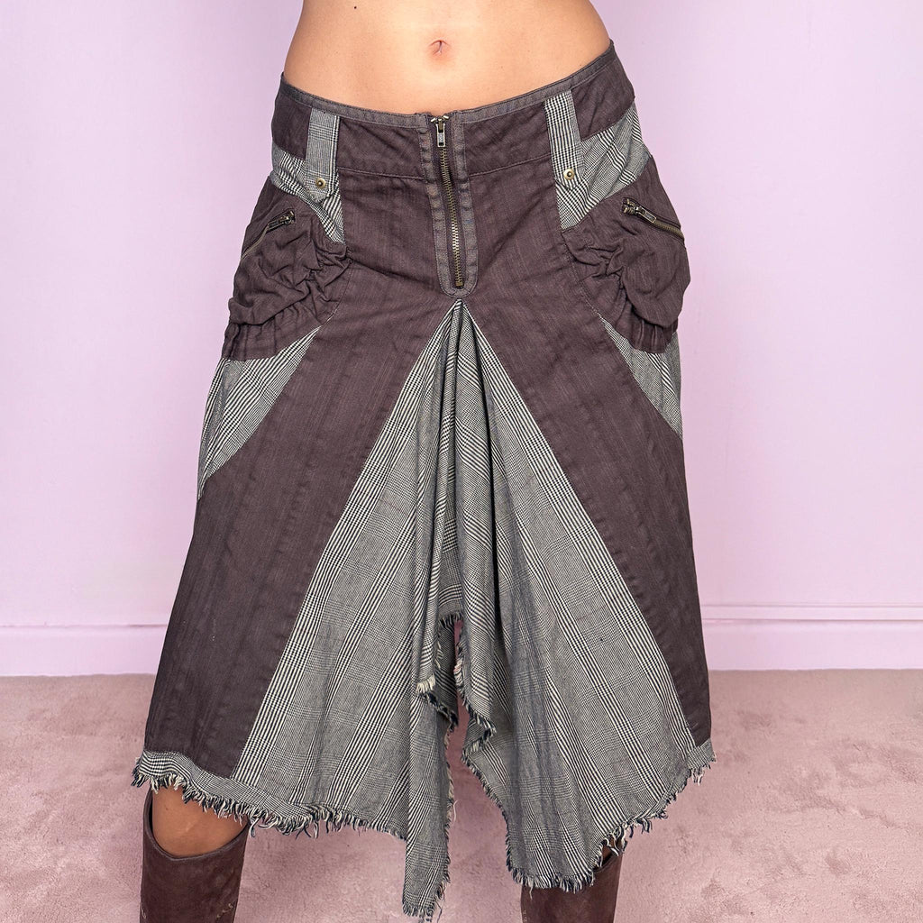 Vintage 2000s deconstructed midi skirt featuring an exposed front zip closure, contrast plaid panel inserts, utility-style pocket detailing, and dramatic asymmetric godet panels with raw frayed edges. The mix of brown and beige tones, visible construction details, and irregular hem give it a distinctly Y2K avant-garde, utilitarian aesthetic. Non-stretch. Can be worn mid-rise for size M or lower on the waist for size S. From a Dutch brand, made from 100% cotton. Excellent vintage condition.