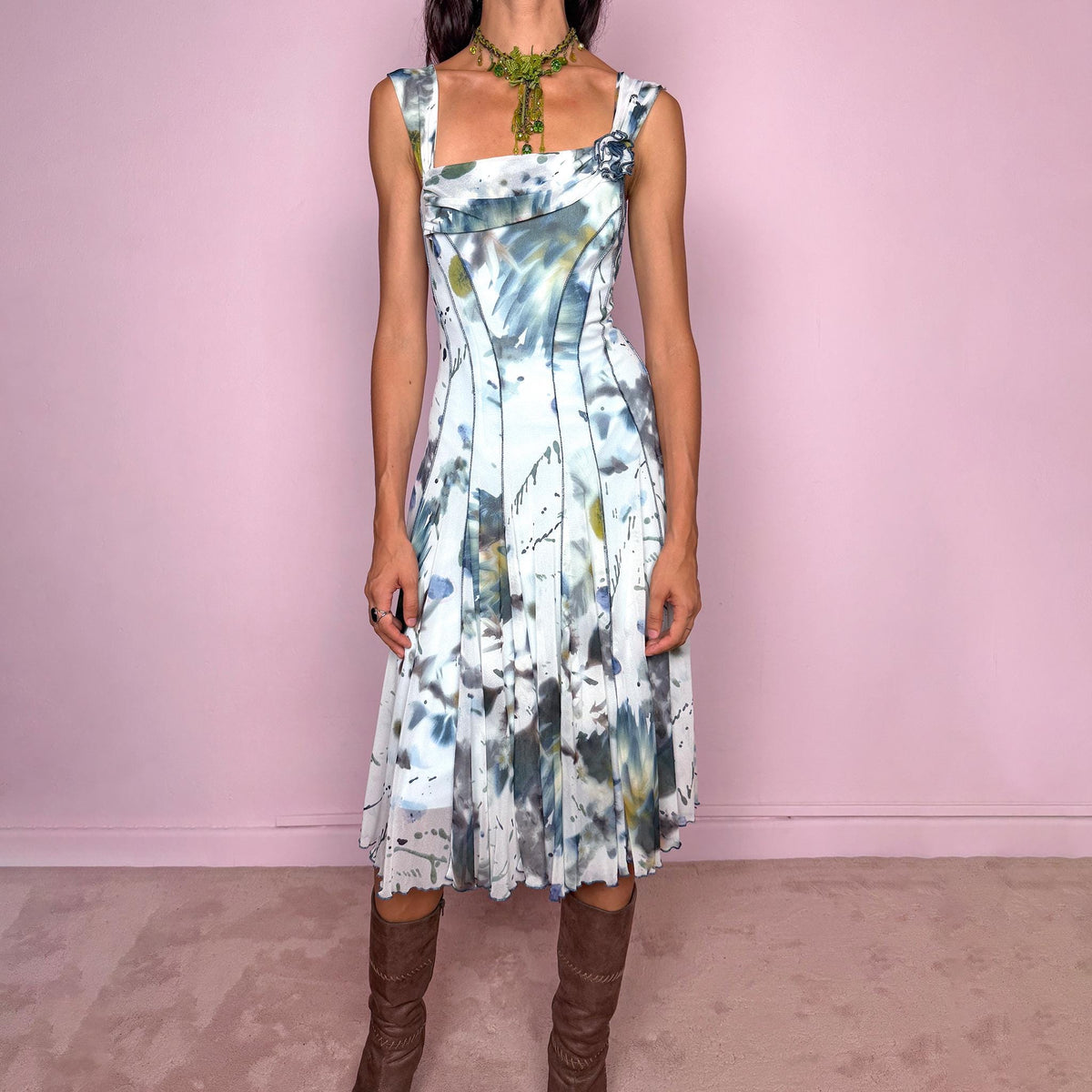 Vintage 2000s art-print midi dress featuring an abstract painterly graphic print in soft blue, gray, olive, and white tones, with a fitted bodice, square neckline, wide shoulder straps, and sculpted panel seams that open into a fluid flared skirt. Finished with a small rosette appliqué at the neckline. A distinctive Y2K art-to-wear piece. Made in the USA by an American brand from stretchy 100% polyamide mesh. Excellent vintage condition.