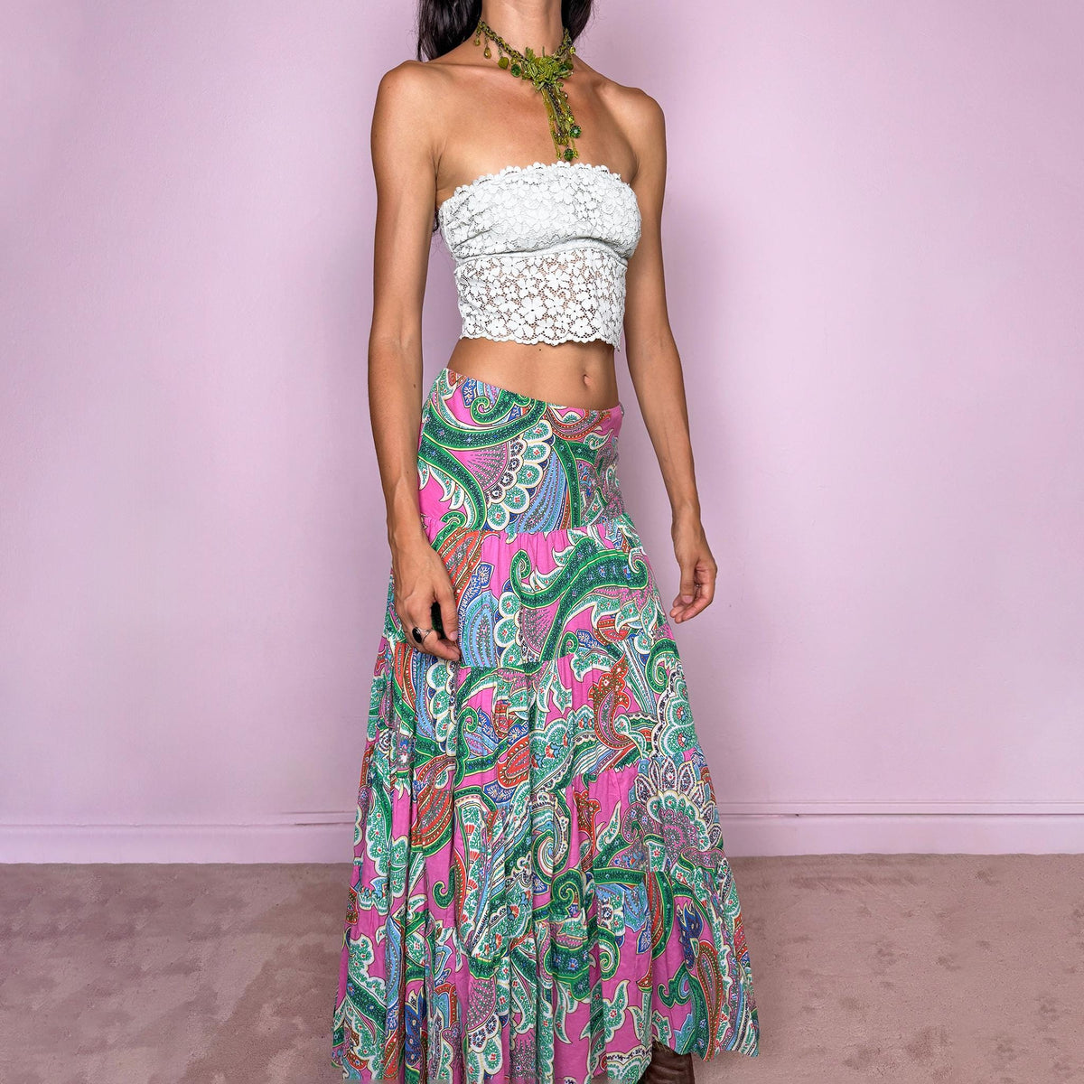 Vintage 2000s bohemian paisley maxi skirt, crafted from 100% cotton with a 100% cotton lining. Features a vibrant all-over paisley print in pink, green, blue, and orange tones, a softly flared tiered silhouette, and an elasticated waist. Can be worn mid- to low-rise for size S. By American brand Lauren Ralph Lauren. Excellent vintage condition.
