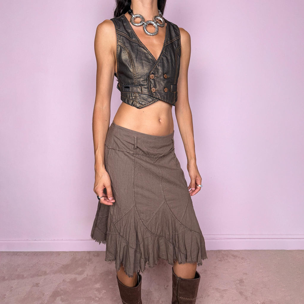 Vintage 2000s brown midi skirt, made in Italy from a structured 95% cotton and 5% elastane blend. Featuring exposed seam detailing, sculptural panel construction, and a flared asymmetric hem finished with raw, frayed edges. Side zip closure. Non-stretch. The earthy, deconstructed construction gives it a rustic, avant-garde aesthetic. Can be worn high-waisted for size M or mid- to lower-rise for sizes S and XS. Excellent vintage condition.