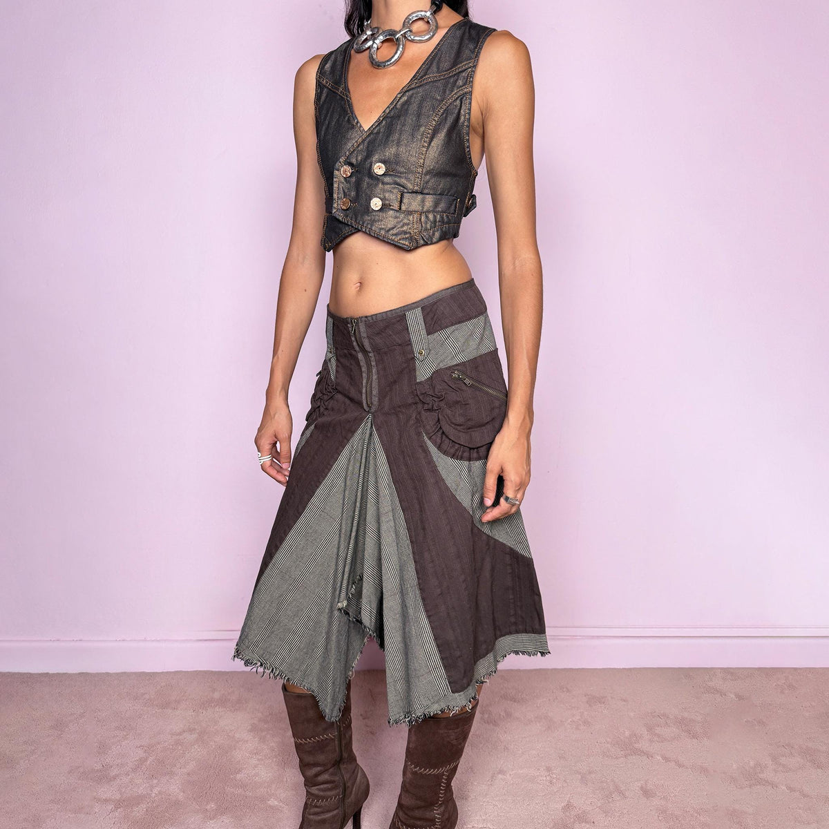 Vintage 2000s deconstructed midi skirt featuring an exposed front zip closure, contrast plaid panel inserts, utility-style pocket detailing, and dramatic asymmetric godet panels with raw frayed edges. The mix of brown and beige tones, visible construction details, and irregular hem give it a distinctly Y2K avant-garde, utilitarian aesthetic. Non-stretch. Can be worn mid-rise for size M or lower on the waist for size S. From a Dutch brand, made from 100% cotton. Excellent vintage condition.