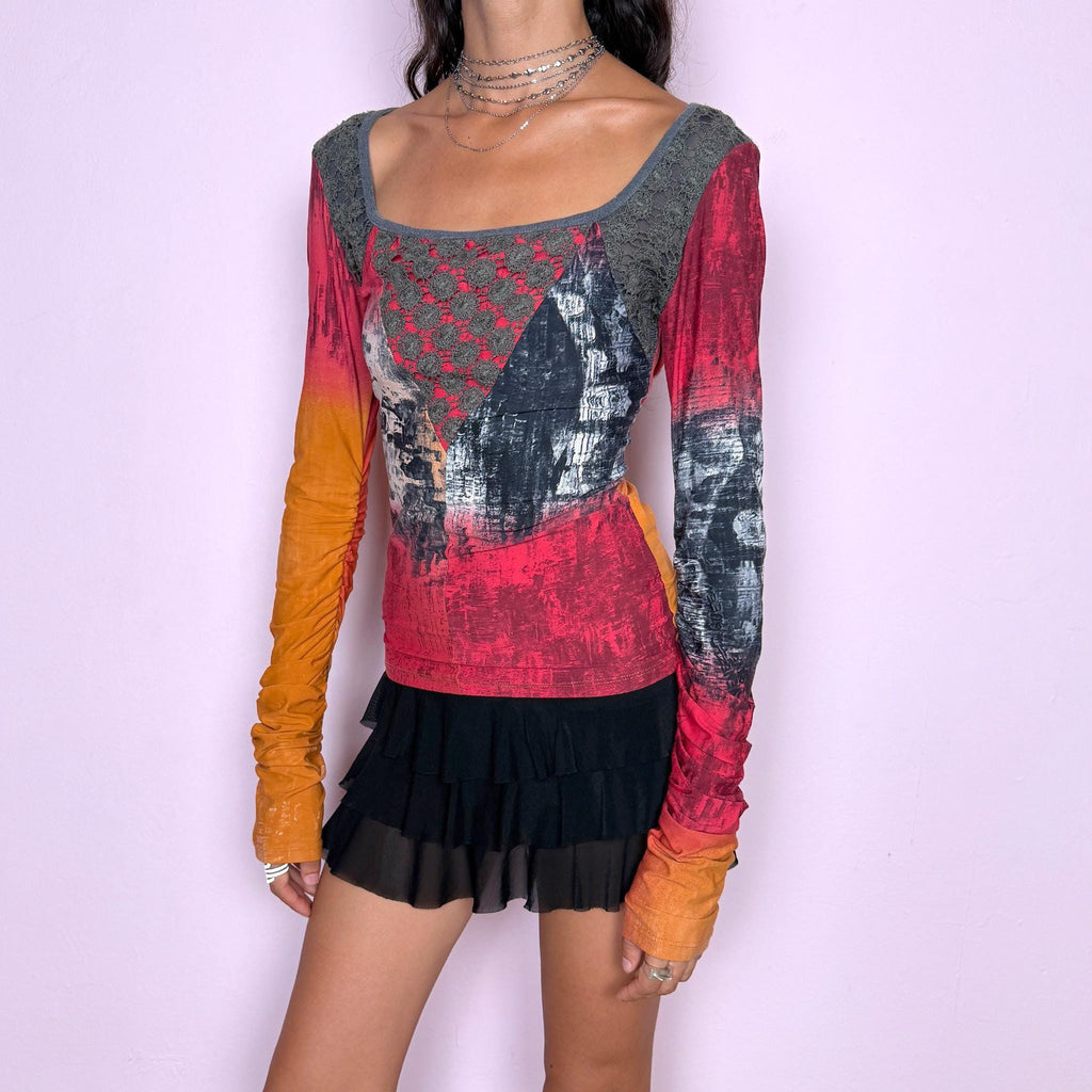 Vintage 2000s long-sleeve top by Italian label Save the Queen, featuring a fitted, body-skimming silhouette, scoop neckline, contrasting lace paneling across the upper bodice, and an abstract painterly print in red, orange, charcoal, and gray tones. Designed with extra-long ruched sleeves for a bold, maximalist aesthetic. Made in Italy from a stretchy 80% polyamide and 20% elastane blend. Excellent vintage condition.