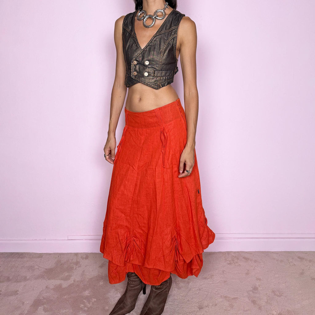 Vintage 2000s deconstructed red-orange linen layered maxi skirt featuring a side zip closure, flared silhouette, and layered construction with gathered, ruched, and draped detailing through the lower skirt. Non-stretch. Can be worn mid-rise on size S or slightly lower on the waist for XS. From a Dutch brand, crafted from 100% linen with a 100% polyester lining. Excellent vintage condition.