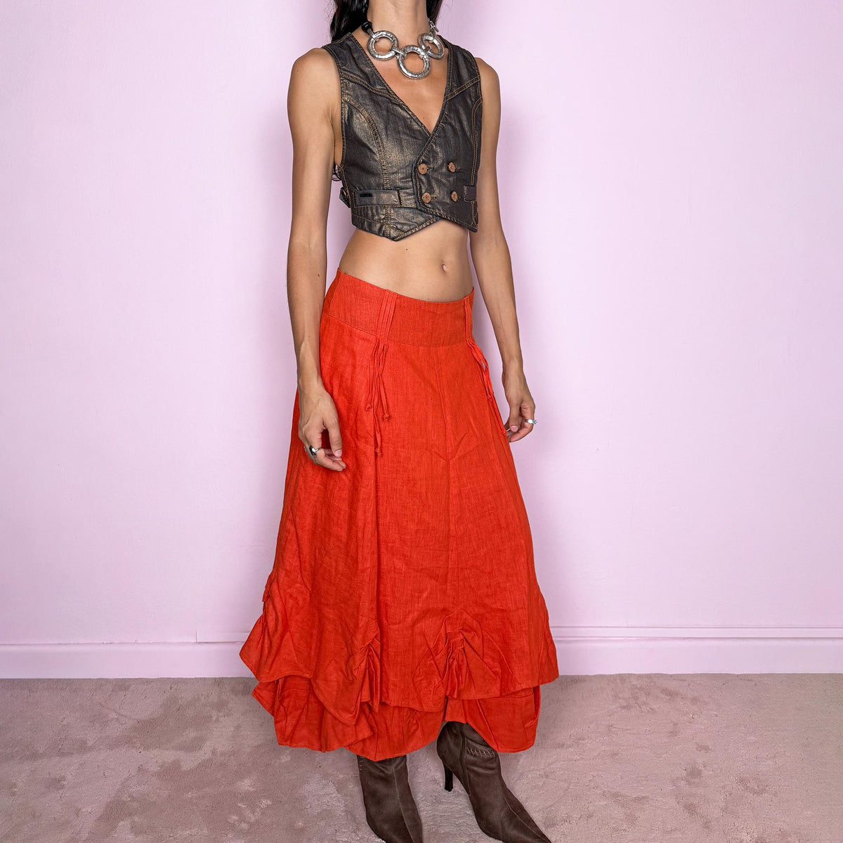 Vintage 2000s deconstructed red-orange linen layered maxi skirt featuring a side zip closure, flared silhouette, and layered construction with gathered, ruched, and draped detailing through the lower skirt. Non-stretch. Can be worn mid-rise on size S or slightly lower on the waist for XS. From a Dutch brand, crafted from 100% linen with a 100% polyester lining. Excellent vintage condition.