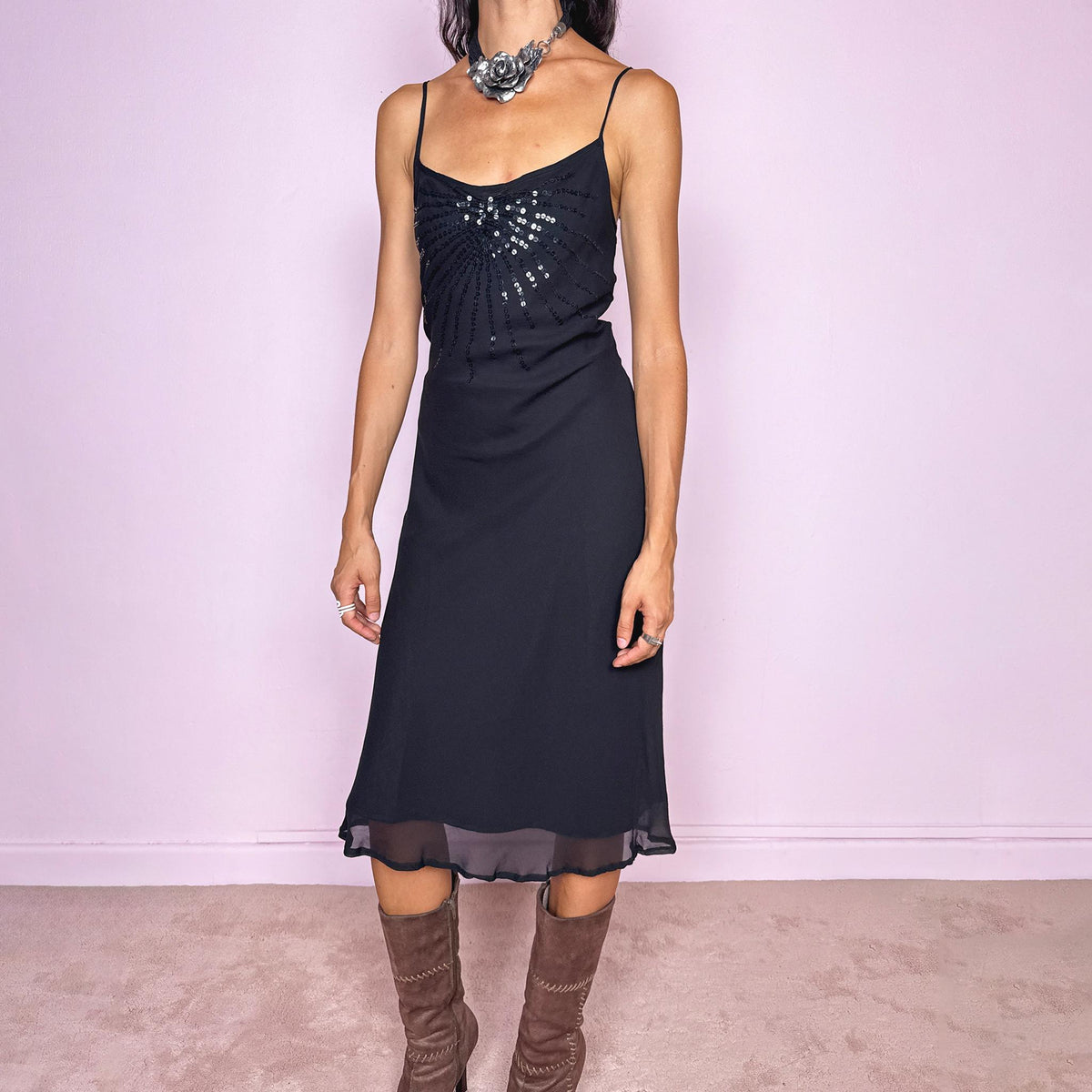 Vintage 2000s black silk midi dress crafted from 100% silk. Featuring a fluid slip-style silhouette with adjustable spaghetti straps and black sequin embellishment across the bust. Lightweight and non-stretch, with a semi-sheer outer layer and black lining underneath. Perfect for minimal evening styling. Excellent vintage condition.