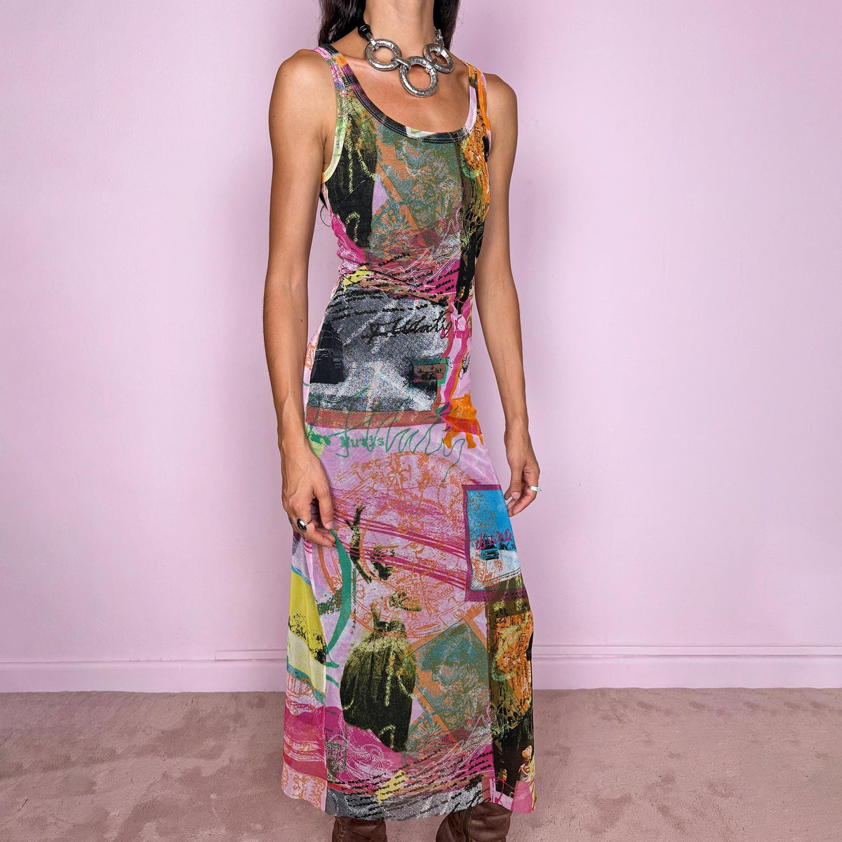 Vintage 2000s fitted mesh midi dress. Featuring a body-skimming sleeveless silhouette with a scoop neckline and a bold maximalist art graphic print in pink, orange, green, blue, and black tones. The lightweight semi-sheer mesh and collage-inspired print give it a distinctly Y2K art-to-wear feel with an avant-garde edge. It has a brown lining. From a French brand, made in France from a stretchy polyamide and polyester blend. Excellent vintage condition.