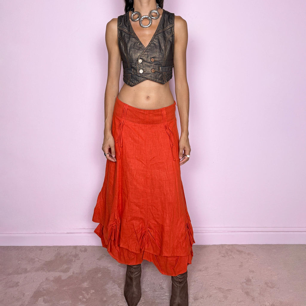 Vintage 2000s deconstructed red-orange linen layered maxi skirt featuring a side zip closure, flared silhouette, and layered construction with gathered, ruched, and draped detailing through the lower skirt. Non-stretch. Can be worn mid-rise on size S or slightly lower on the waist for XS. From a Dutch brand, crafted from 100% linen with a 100% polyester lining. Excellent vintage condition.