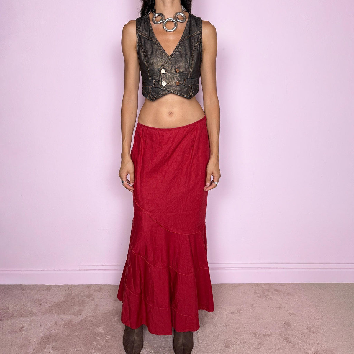 Vintage 2000s red linen midi skirt crafted from 100% linen. Featuring a curved asymmetric seam construction and a layered, flared lower section that creates fluid movement. Finished with a side zip closure. Non-stretch. Can be worn mid-rise for size M or lower on the waist for size S. From a German brand. Great vintage condition.