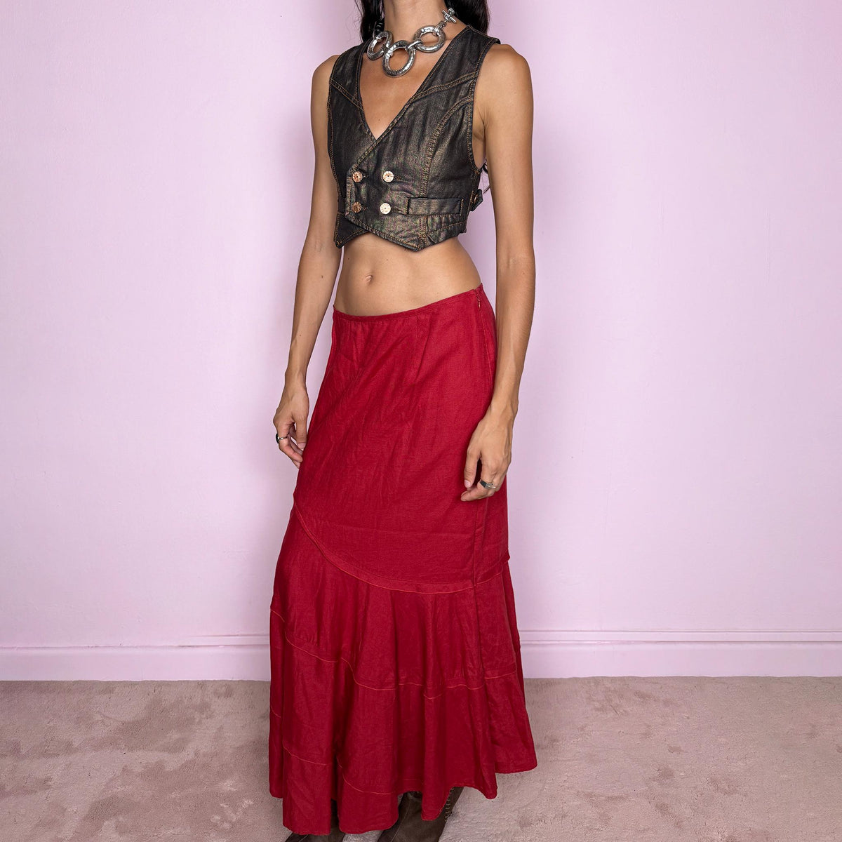 Vintage 2000s red linen midi skirt crafted from 100% linen. Featuring a curved asymmetric seam construction and a layered, flared lower section that creates fluid movement. Finished with a side zip closure. Non-stretch. Can be worn mid-rise for size M or lower on the waist for size S. From a German brand. Great vintage condition.