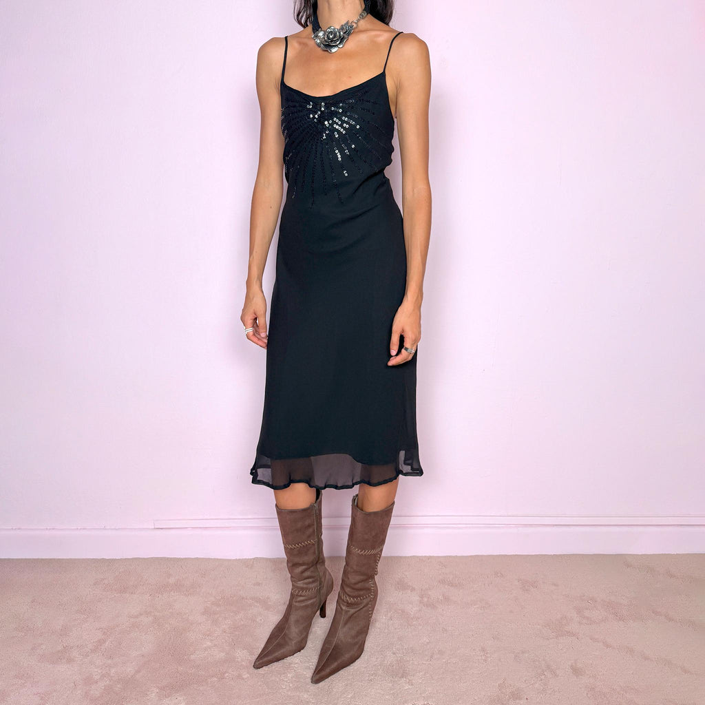 Vintage 2000s black silk midi dress crafted from 100% silk. Featuring a fluid slip-style silhouette with adjustable spaghetti straps and black sequin embellishment across the bust. Lightweight and non-stretch, with a semi-sheer outer layer and black lining underneath. Perfect for minimal evening styling. Excellent vintage condition.