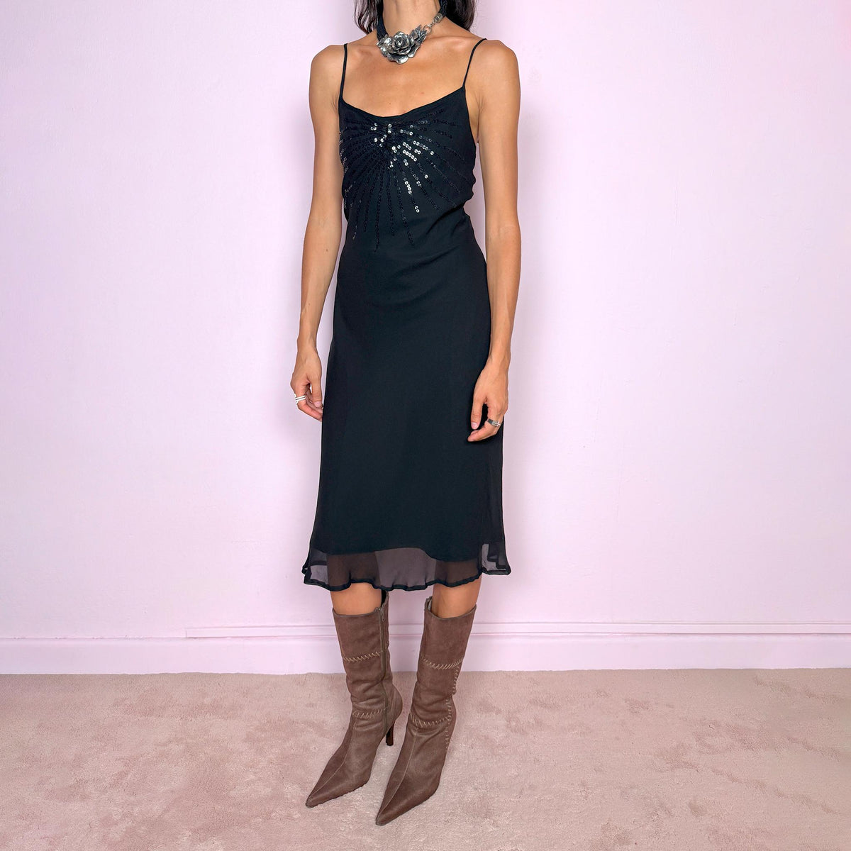 Vintage 2000s black silk midi dress crafted from 100% silk. Featuring a fluid slip-style silhouette with adjustable spaghetti straps and black sequin embellishment across the bust. Lightweight and non-stretch, with a semi-sheer outer layer and black lining underneath. Perfect for minimal evening styling. Excellent vintage condition.