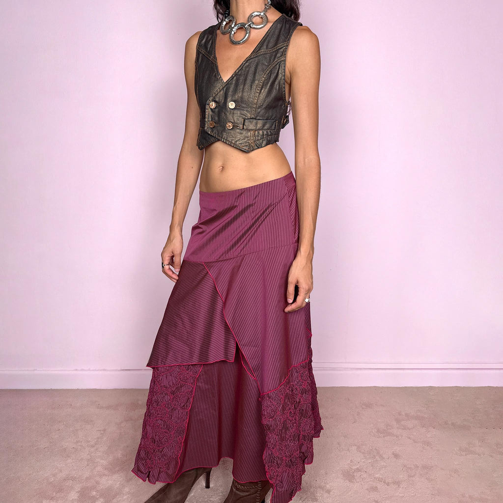 Vintage 2000s burgundy asymmetric maxi skirt featuring a side zip closure and an irregular layered construction combining fine pinstripe panels with ruched and gathered textured sections. Can be worn high-waisted for size L or lower on the waist for sizes M–S. From a French brand, made from 100% non-stretch polyester. Excellent vintage condition.