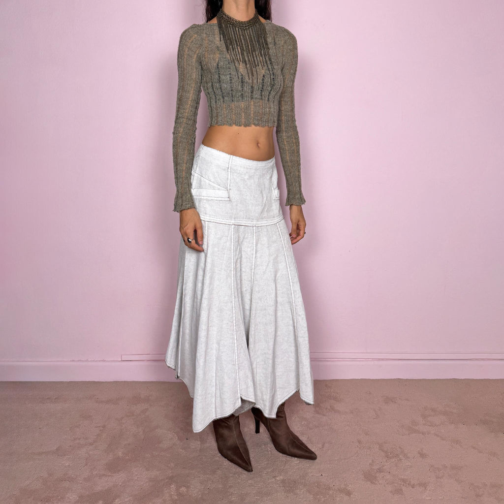 Vintage 2000s greyish-white maxi skirt by Belgian label Sarah Pacini, made in Italy from a non-stretch ramie blend. Features a fitted upper section, contrast topstitching, a back zip, a paneled flared silhouette, and an irregular handkerchief hem. Softly distressed, washed finish with a painted effect. Can be worn mid-rise for size S or lower on the waist for size XS. Excellent vintage condition.