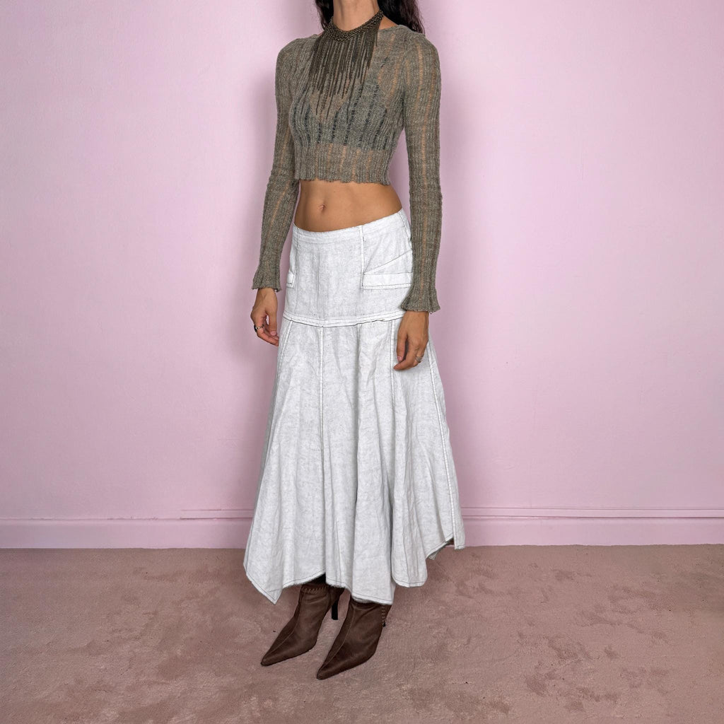 Vintage 2000s greyish-white maxi skirt by Belgian label Sarah Pacini, made in Italy from a non-stretch ramie blend. Features a fitted upper section, contrast topstitching, a back zip, a paneled flared silhouette, and an irregular handkerchief hem. Softly distressed, washed finish with a painted effect. Can be worn mid-rise for size S or lower on the waist for size XS. Excellent vintage condition.