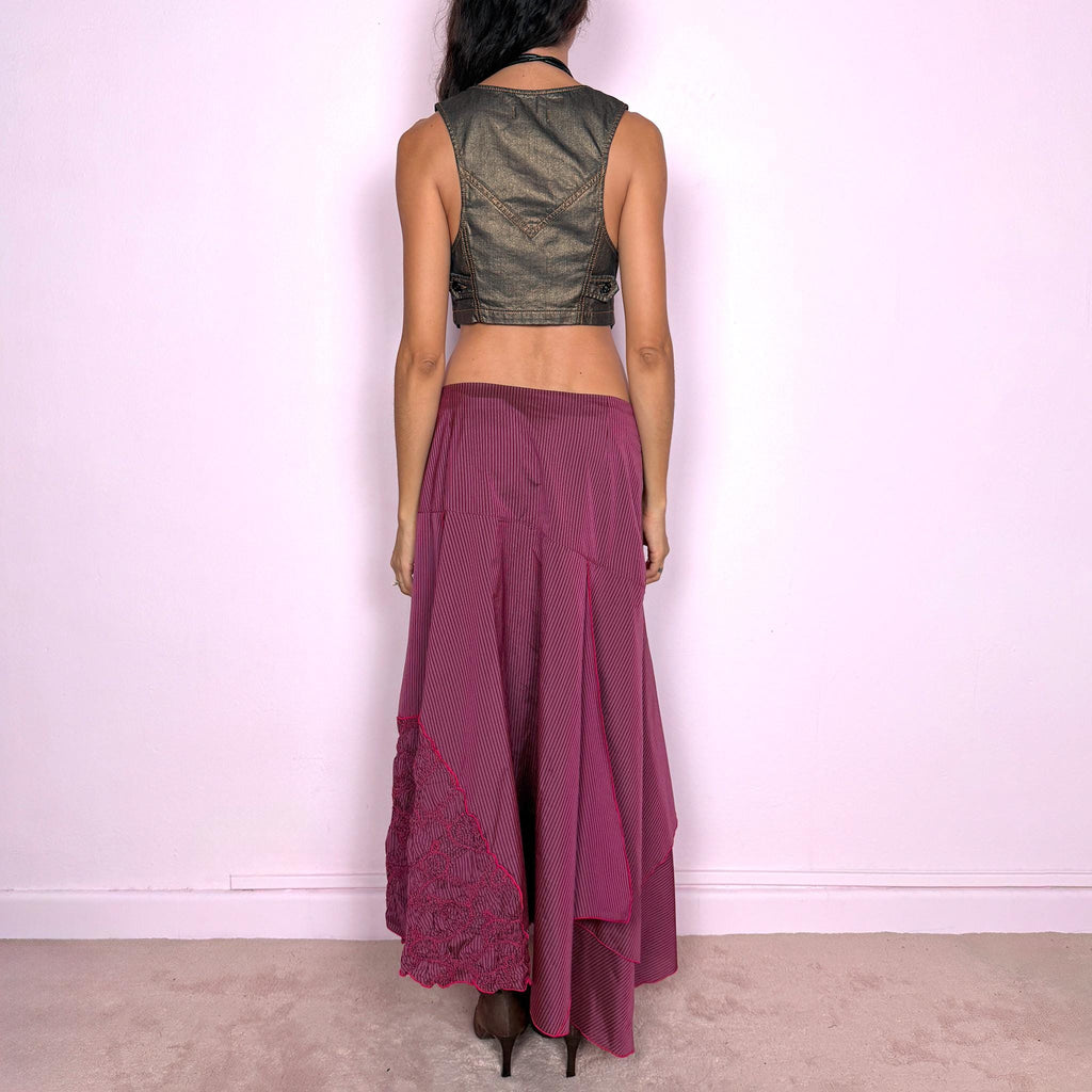 Vintage 2000s burgundy asymmetric maxi skirt featuring a side zip closure and an irregular layered construction combining fine pinstripe panels with ruched and gathered textured sections. Can be worn high-waisted for size L or lower on the waist for sizes M–S. From a French brand, made from 100% non-stretch polyester. Excellent vintage condition.