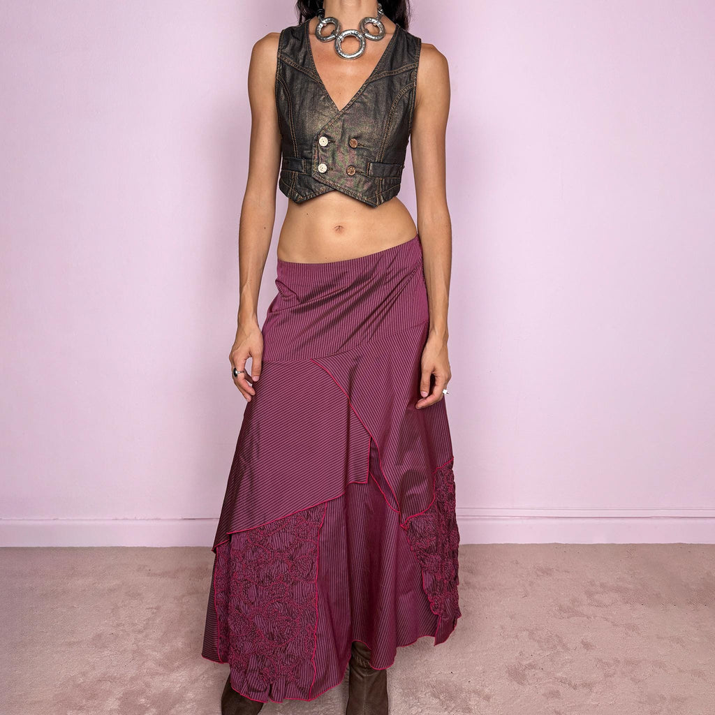 Vintage 2000s burgundy asymmetric maxi skirt featuring a side zip closure and an irregular layered construction combining fine pinstripe panels with ruched and gathered textured sections. Can be worn high-waisted for size L or lower on the waist for sizes M–S. From a French brand, made from 100% non-stretch polyester. Excellent vintage condition.