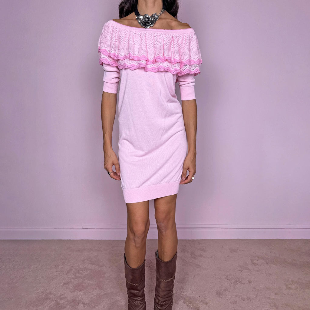Vintage 2000s light pink knit mini dress by Italian designer label Blumarine, made in Italy from a stretchy 67% viscose and 33% cotton blend. Features a soft straight silhouette with an off-the-shoulder neckline, layered pointelle-knit ruffle detailing across the shoulders, elbow-length sleeves and ribbed trim at the hem and cuffs. Excellent vintage condition.
