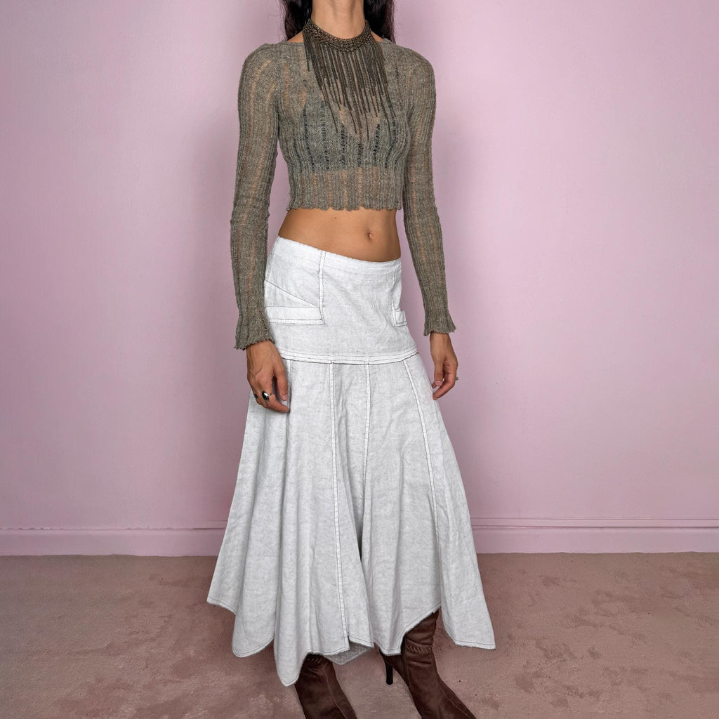 Vintage 2000s greyish-white maxi skirt by Belgian label Sarah Pacini, made in Italy from a non-stretch ramie blend. Features a fitted upper section, contrast topstitching, a back zip, a paneled flared silhouette, and an irregular handkerchief hem. Softly distressed, washed finish with a painted effect. Can be worn mid-rise for size S or lower on the waist for size XS. Excellent vintage condition.
