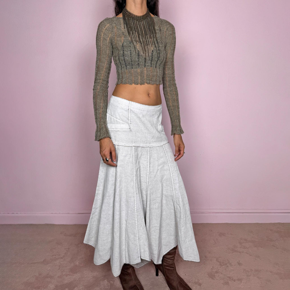 Vintage 2000s greyish-white maxi skirt by Belgian label Sarah Pacini, made in Italy from a non-stretch ramie blend. Features a fitted upper section, contrast topstitching, a back zip, a paneled flared silhouette, and an irregular handkerchief hem. Softly distressed, washed finish with a painted effect. Can be worn mid-rise for size S or lower on the waist for size XS. Excellent vintage condition.