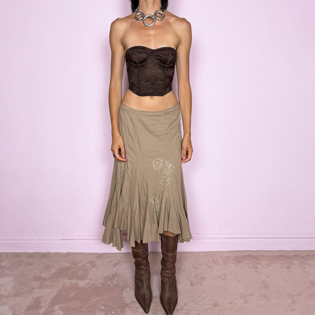 Vintage 2000s khaki beige asymmetric midi skirt in 100% cotton with a side zip closure and no stretch. Features embroidered sequin details, soft paneling, and a flared uneven ruffle hem. Romantic Y2K bohemian style, perfect for fairy summer looks. Can be worn high-waisted for size S or slightly lower on the waist for sizes XS and XXS. From a French brand. Excellent vintage condition.
