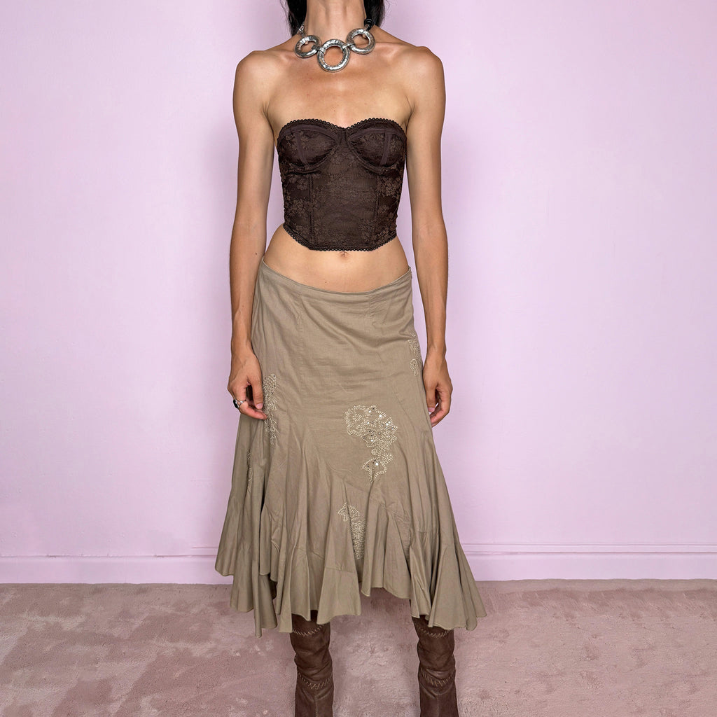 Vintage 2000s khaki beige asymmetric midi skirt in 100% cotton with a side zip closure and no stretch. Features embroidered sequin details, soft paneling, and a flared uneven ruffle hem. Romantic Y2K bohemian style, perfect for fairy summer looks. Can be worn high-waisted for size S or slightly lower on the waist for sizes XS and XXS. From a French brand. Excellent vintage condition.
