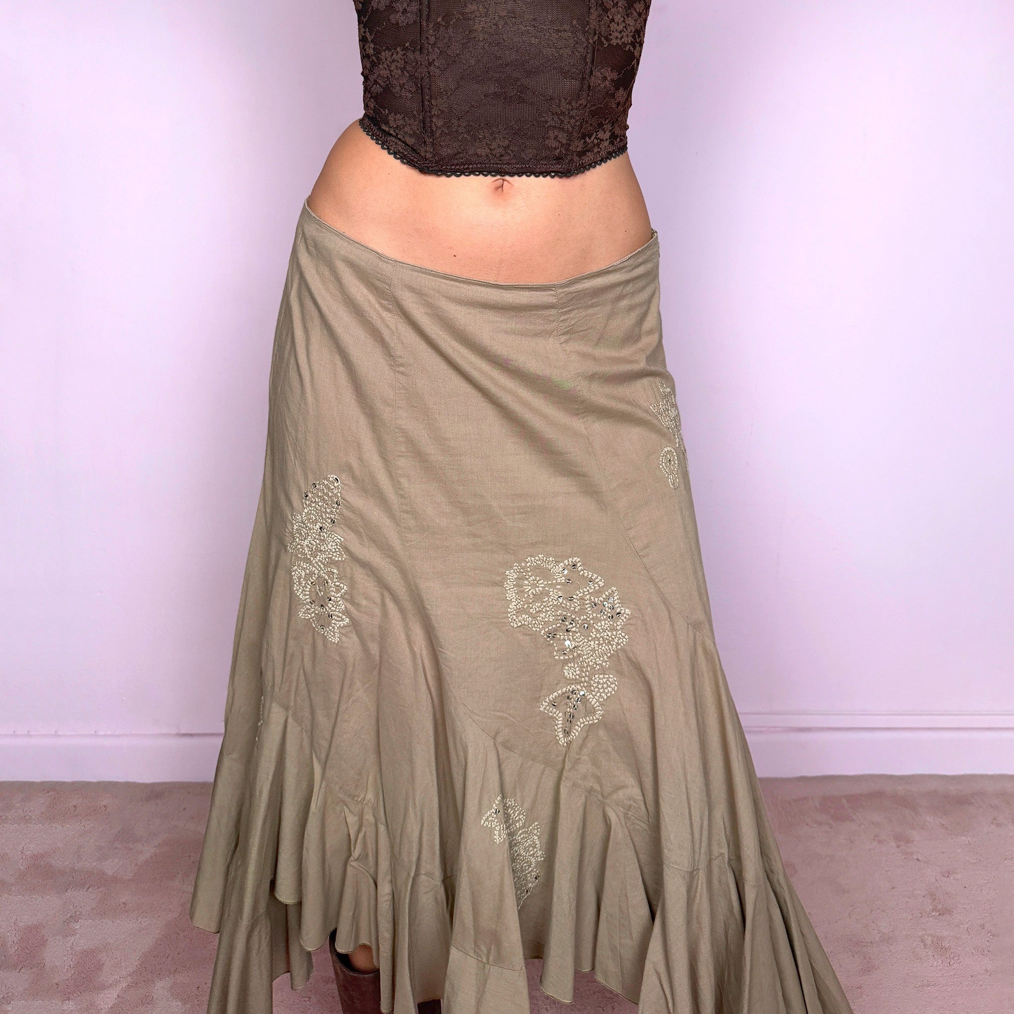 Vintage 2000s khaki beige asymmetric midi skirt in 100% cotton with a side zip closure and no stretch. Features embroidered sequin details, soft paneling, and a flared uneven ruffle hem. Romantic Y2K bohemian style, perfect for fairy summer looks. Can be worn high-waisted for size S or slightly lower on the waist for sizes XS and XXS. From a French brand. Excellent vintage condition.